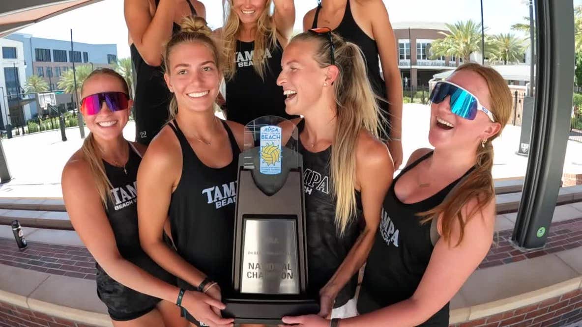 Celebration in the sand for women's college volleyball team